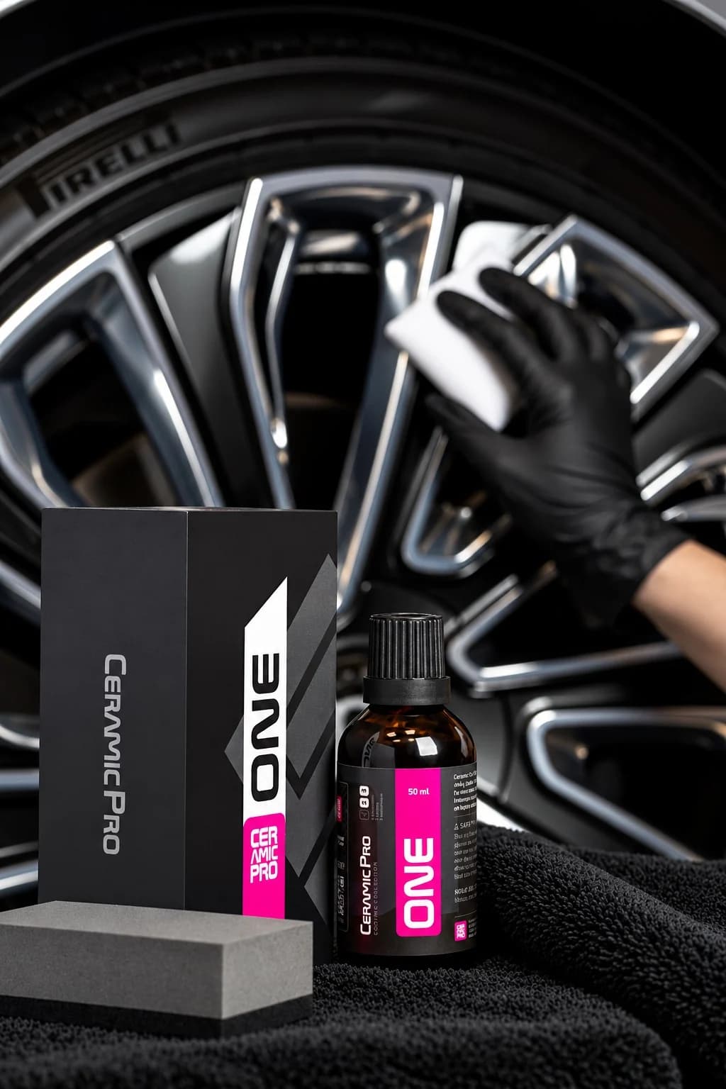 Installer coating a wheel with ONE kit in the foreground